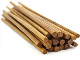 Stacked wooden sticks arranged neatly for crafting and projects photo