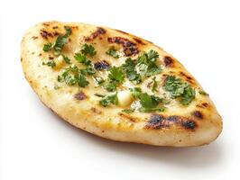 Delicious naan with fresh herbs served on a white background photo