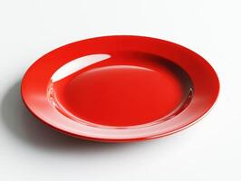 Bright red plate on white surface for dining and decoration photo