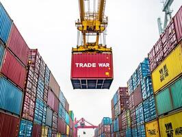 Heavy crane lifting red container labeled Trade War at dock photo