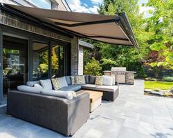 Cozy outdoor seating area with grill in a sunny garden photo