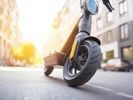 Electric scooter parked on a sunny city street in the afternoon photo
