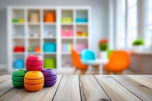 Colorful stacking toys on a wooden table in a bright playroom with organized shelves and inviting seating arrangements. Childrens playroom with toys in vibrant colors on a wooden table photo