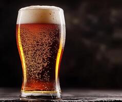 Craft beer in a frosty glass served at a bar photo