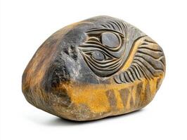 Artistic stone carving featuring abstract design with eye motif photo