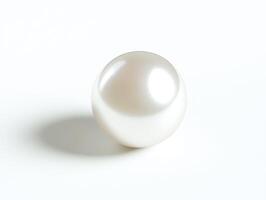Shimmering pearl resting on a flat surface in soft light photo