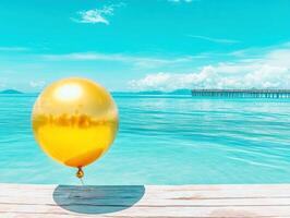Sunny beach with golden balloon near tranquil sea photo