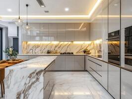 Modern kitchen design with elegant marble surfaces and lighting photo