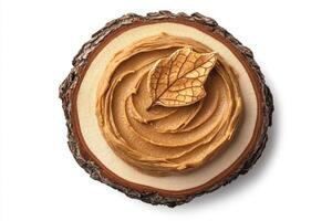 Natural peanut butter served on a rustic wooden platter photo