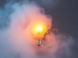 Light bulb glowing amidst thick smoke in a dark setting photo