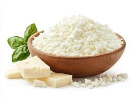 Fresh cottage cheese served in a wooden bowl with basil photo