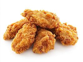 Crispy fried chicken pieces arranged on a white background photo