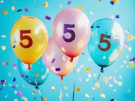 Colorful balloons celebrate a special occasion with confetti photo