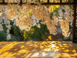 Delicate white flowers cascading over a serene wooden surface photo