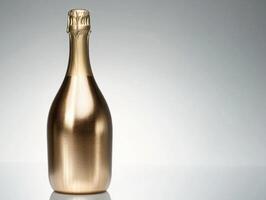 Elegant golden bottle of sparkling wine on a smooth surface photo