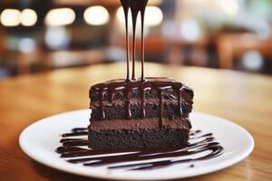 Decadent chocolate cake with rich ganache drizzling on top photo