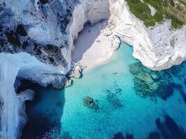 Beautiful secluded beach with turquoise water and white cliffs photo