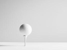 Golf ball on a tee ready for a perfect swing in minimal setting photo