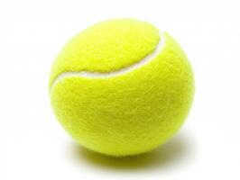 Bright yellow tennis ball on white background in studio setting photo