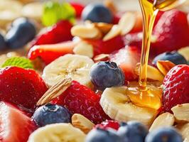Healthy fruit salad with honey drizzle and nuts for breakfast photo