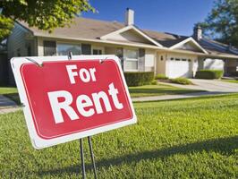 House for rent in a peaceful neighborhood on a sunny day photo