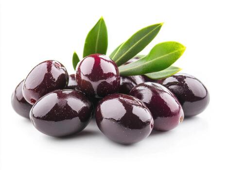 Fresh black olives with leaves arranged on a light background photo