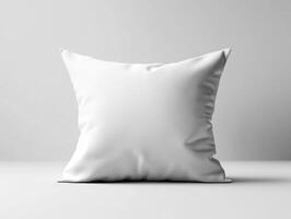 White decorative pillow on a clean surface in bright lighting photo