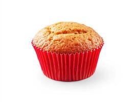 Freshly baked muffin with red wrapper on white background photo