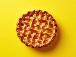 Delicious homemade apple pie on a bright yellow backdrop photo