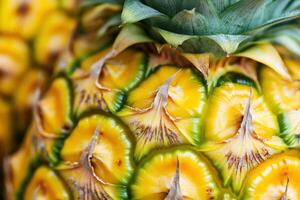 Pineapple with vibrant yellow and green texture on display photo