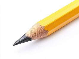 Close-up of a sharpened yellow pencil against a white background photo