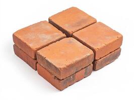 Bricks arranged neatly on a white surface for construction use photo