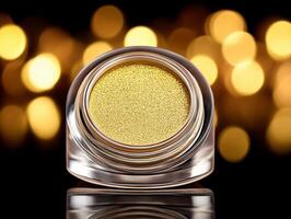 Sparkling golden eyeshadow with smooth texture and reflective particles on dark background, high resolution. Golden eyeshadow with smooth and shimmery texture shines brightly against dark background photo