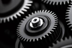 Close up of interlocking gears rotating smoothly in a complex mechanism photo