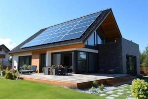 Modern house with solar panels generating green energy on sunny day photo