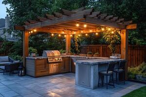 Modern outdoor kitchen with pergola and string lights illuminating backyard patio photo