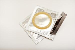 An open condom in a package. Male contraceptives. Confidence in Every Use photo