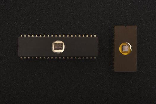 Nostalgic radio engineering elements. Several microchips on black foam. Old integrated circuits for radio electronics. photo