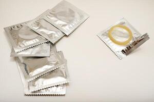 An open condom in a package. Male contraceptives. Smooth Fit, Uninterrupted Moments photo
