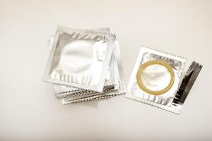 An open condom in a package. Male contraceptives. Clinically Tested, Proven Reliability photo