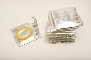 An open condom in a package. Male contraceptives. Advanced Protection Technology photo