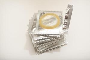 An open condom in a package. Male contraceptives. Trusted Contraceptive Solution photo