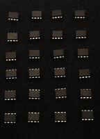 Electronic dies on onyx base. Grouped nodes on a foundation. photo