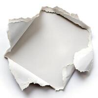 A torn piece of paper revealing a blank space perfect for your message or design with soft white background and irregular edges showing texture photo