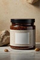 Natural jar of scrub with a plain label set on a textured surface with decorative stones, showcasing a minimalist aesthetic photo