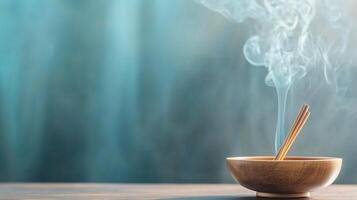 Incense burning in wooden bowl creates serene atmosphere with smoke rising against a tranquil background photo