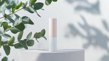 Minimalist beauty product displayed against soft shadows of greenery in a serene setting photo