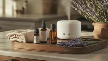 Essential oil diffuser and aromatic oils arranged on a wooden tray in a cozy home setting photo
