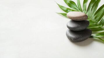 Stacked stones and green leaves create a calming atmosphere for relaxation and meditation photo