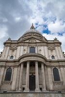 The Cathedral of St. Paul is captured head on , displaying its monumental dome and sculpted stonework, a true masterpiece of English Baroque architecture. photo